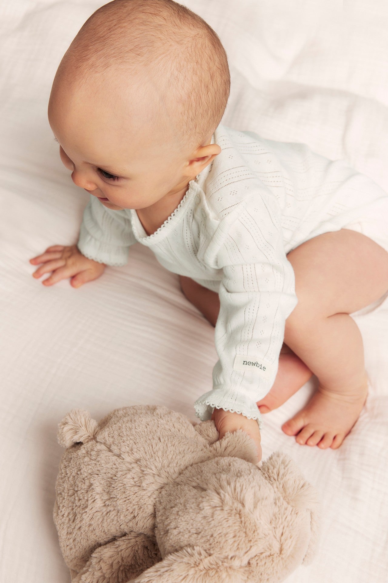Baby white pointelle bodysuit