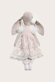 Cuddly beige toy rabbit with tutu
