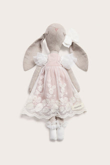 Cuddly beige toy rabbit with tutu