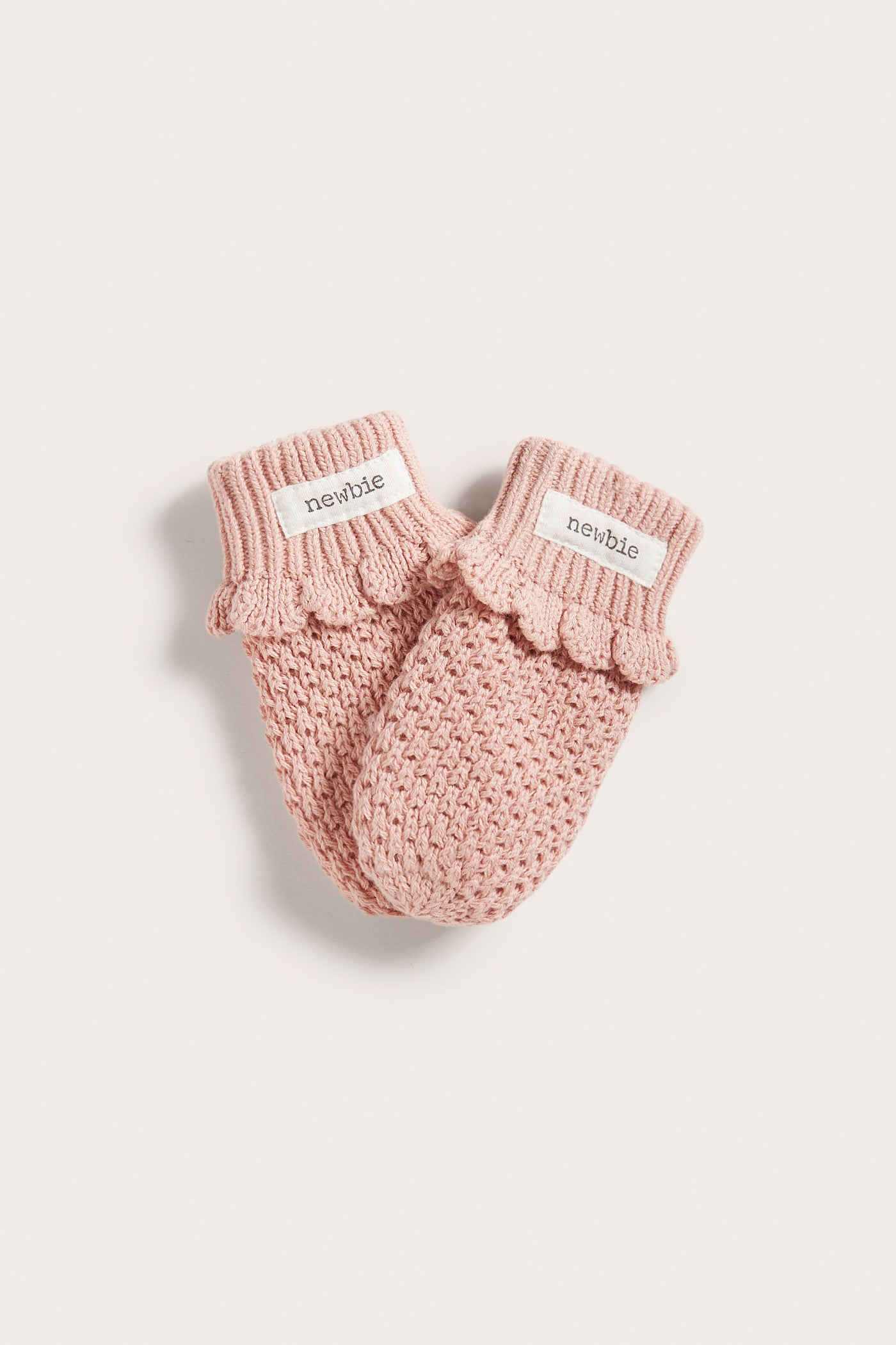 Baby pink knitted mittens Newbie
