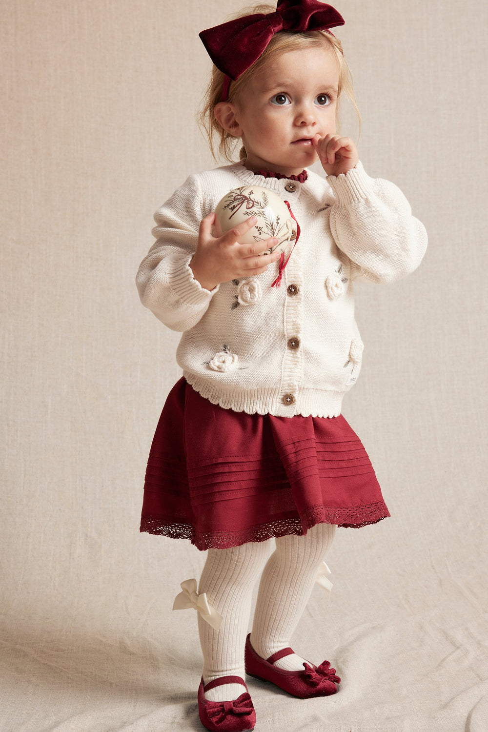 Baby white knitted cardigan
