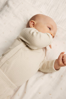 Baby beige ribbed bodysuit with extender