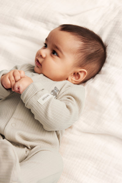 Baby beige ribbed sleepsuit
