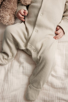 Baby beige ribbed sleepsuit