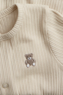 Baby beige ribbed sleepsuit