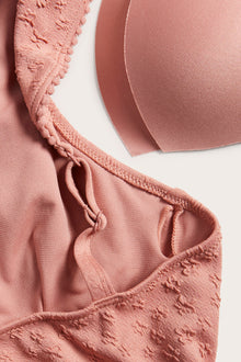 Women's pink swimsuit with ruffles