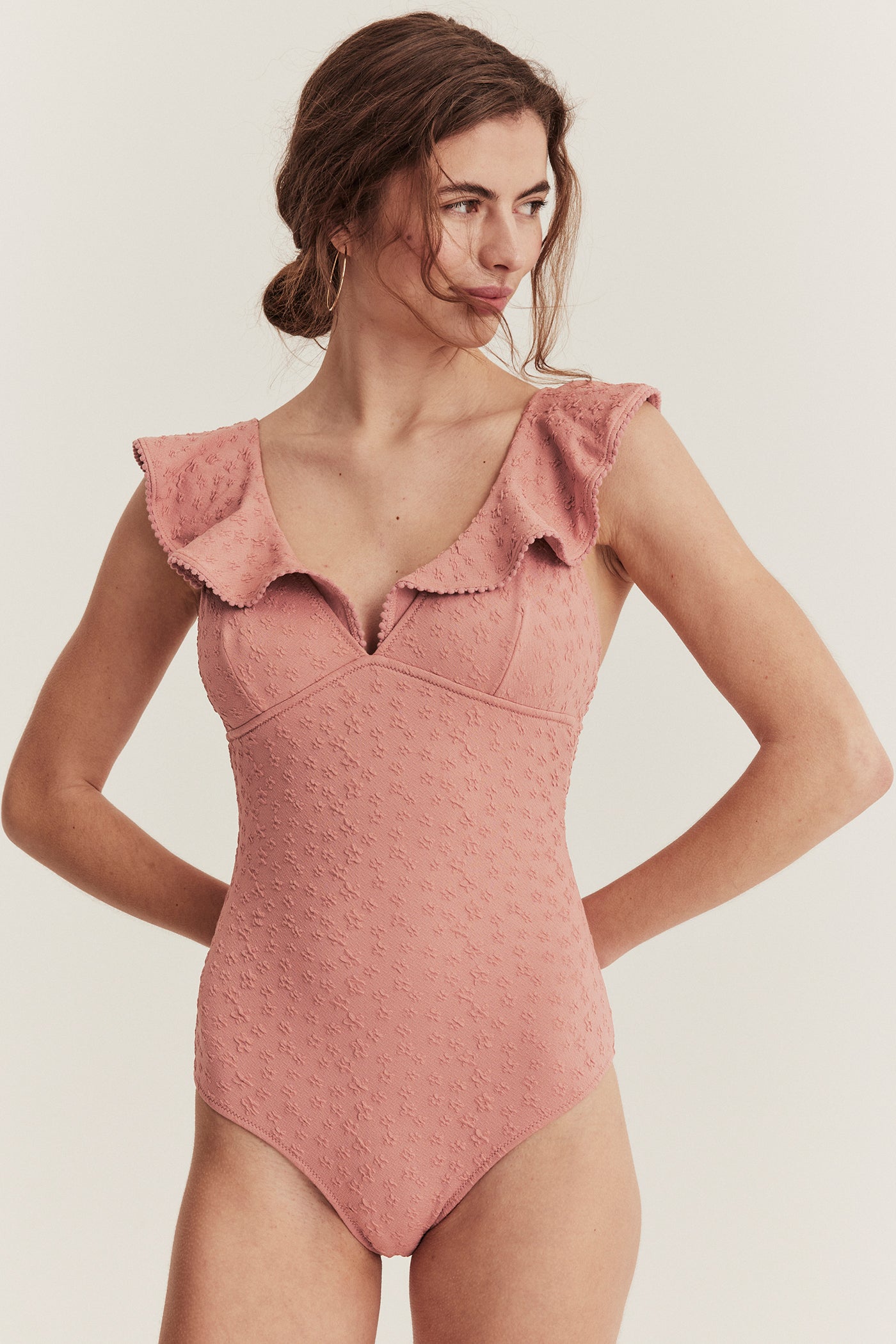 Women's pink swimsuit with ruffles