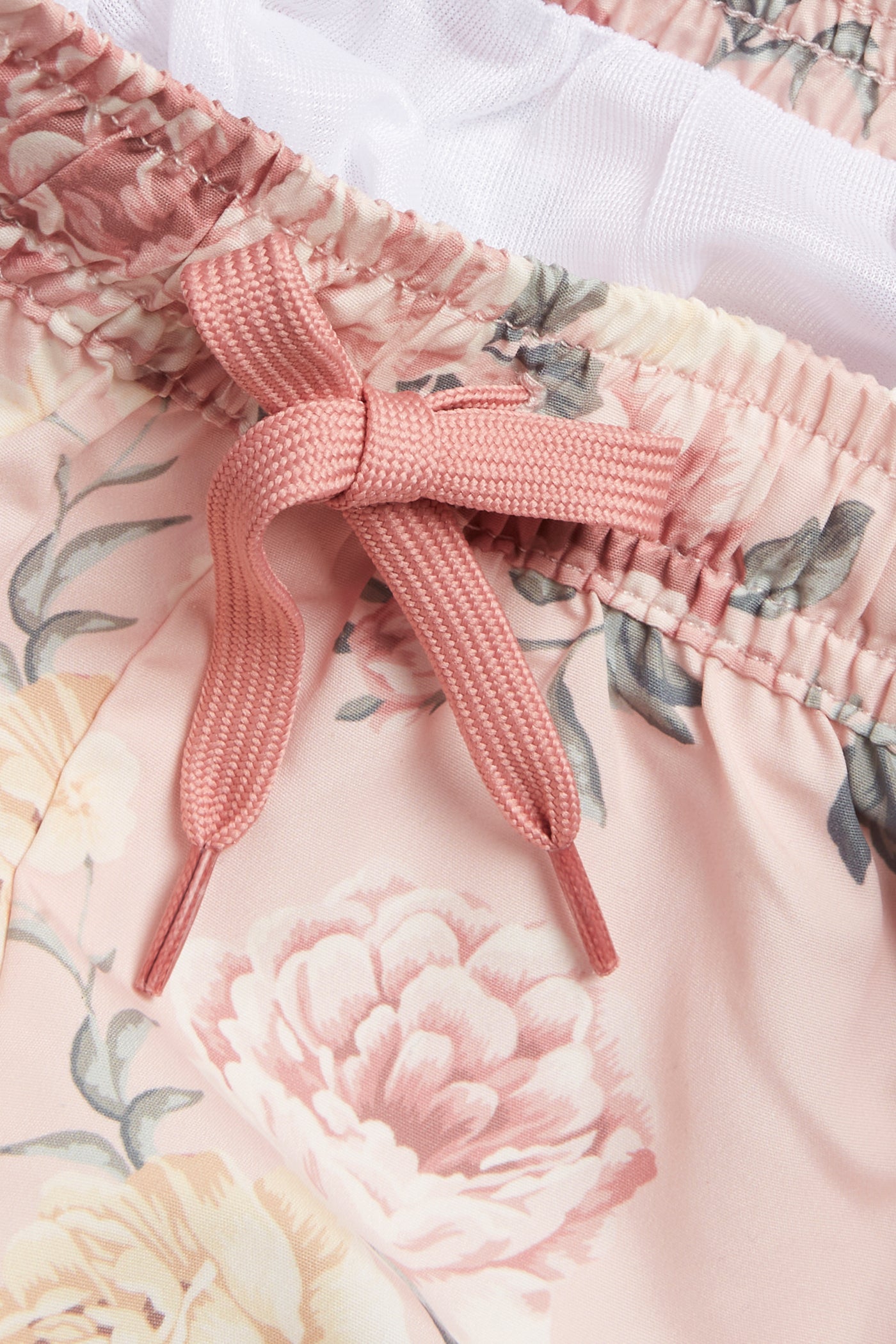 Kids' pink floral swimming trunks