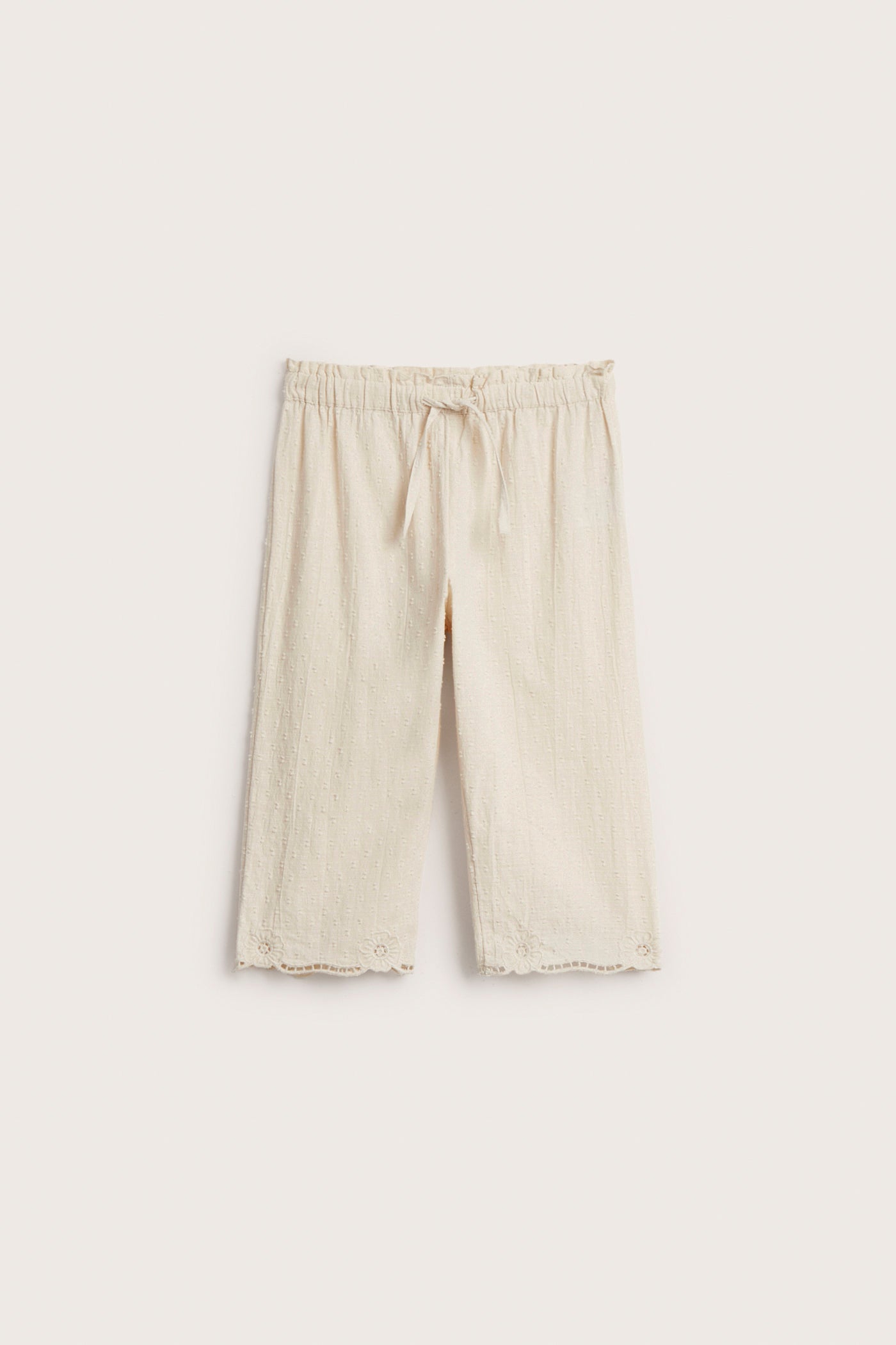 Kids´ beige embroidered trousers