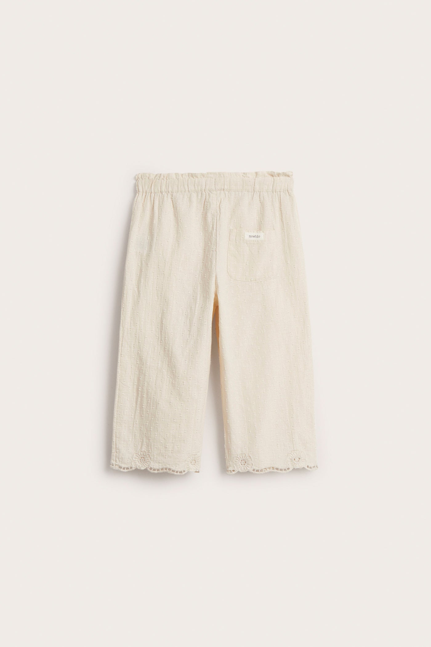 Kids´ beige embroidered trousers
