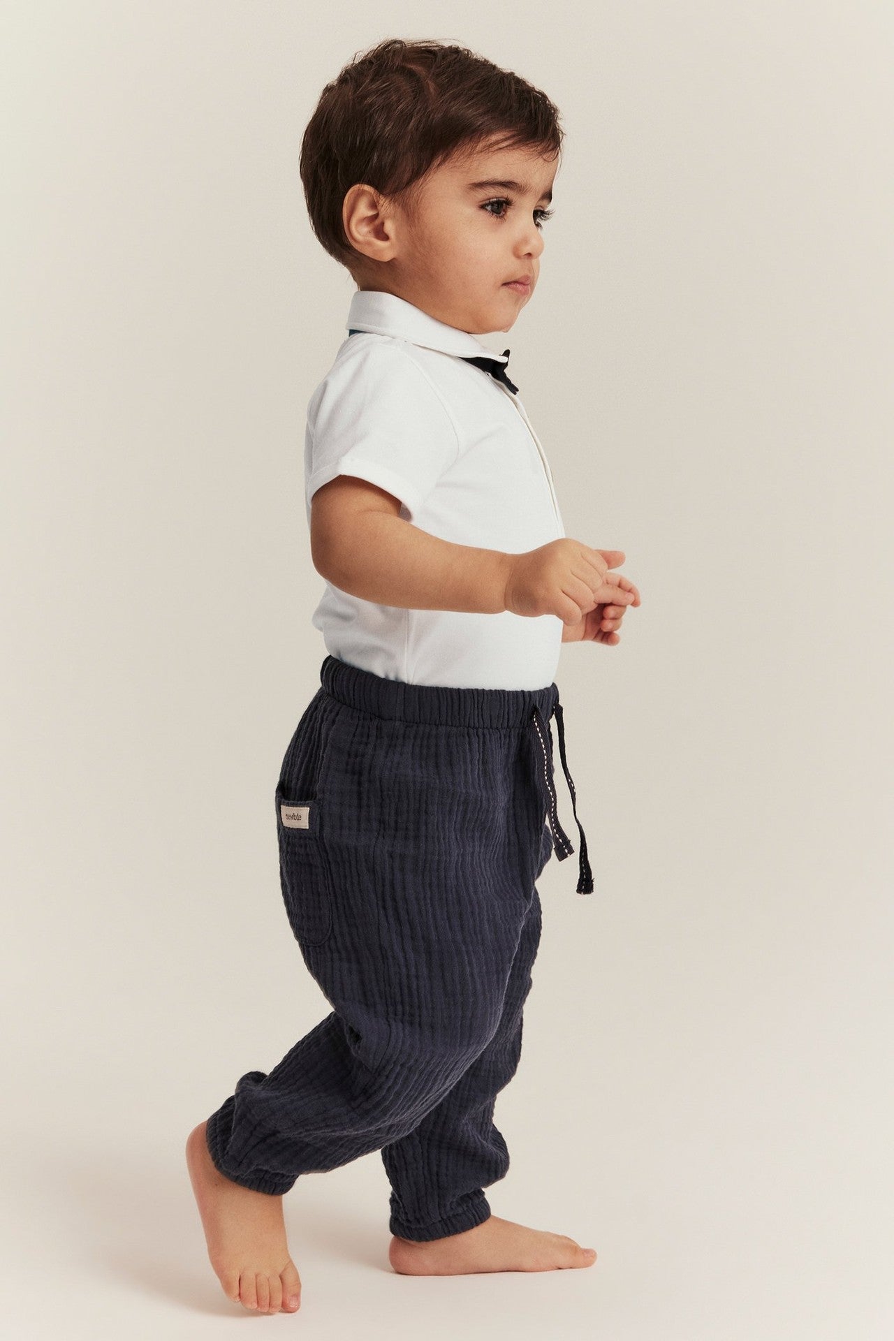 Baby white bow tie bodysuit