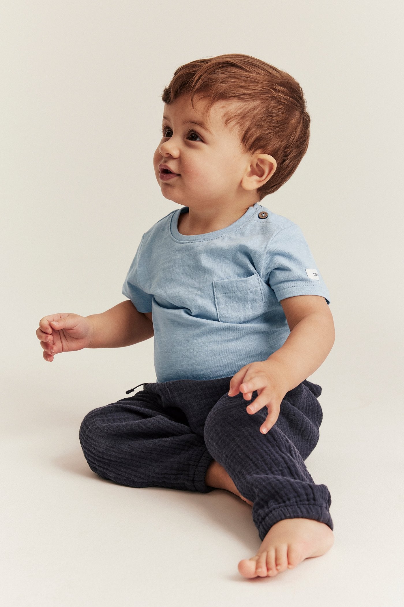 Baby blue bodysuit with chest pocket
