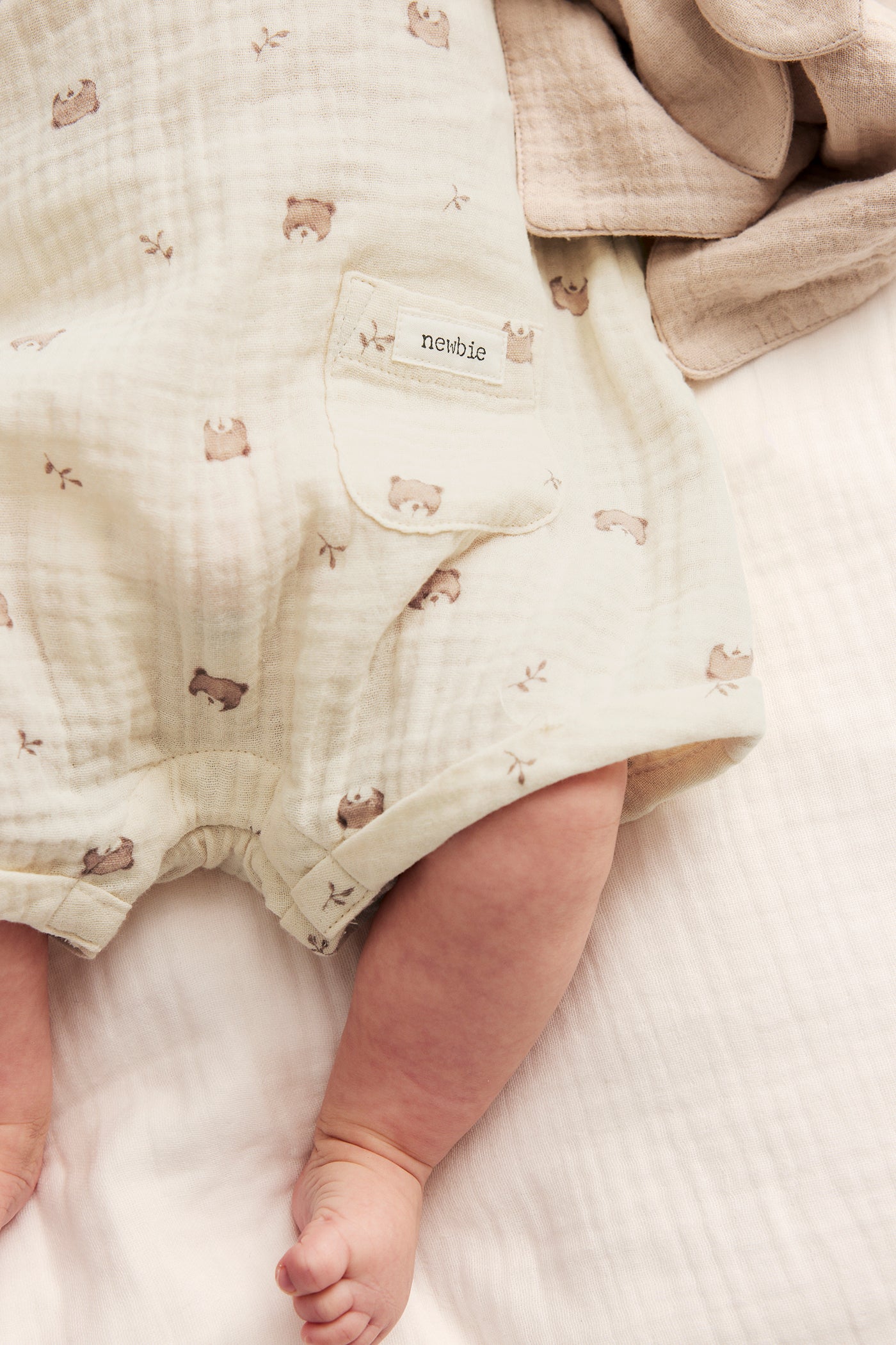 Baby beige romper with teddy bears