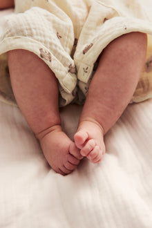 Baby beige romper with teddy bears