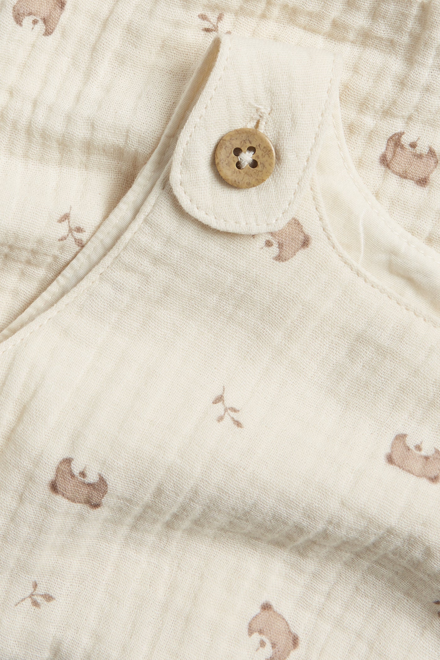 Baby beige romper with teddy bears
