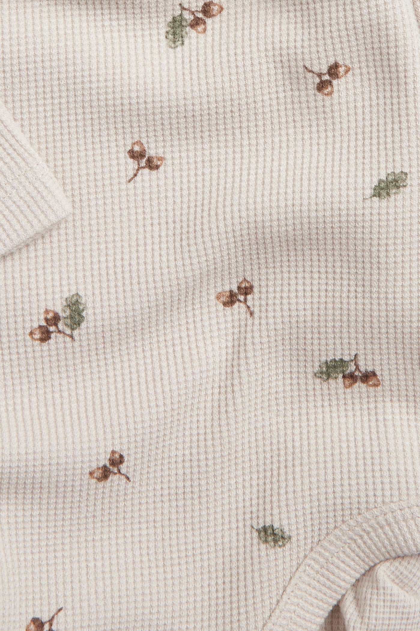 Baby beige bodysuit with acorns