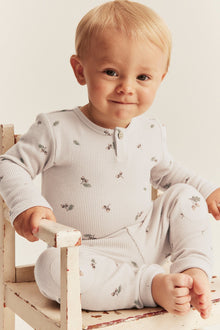 Baby beige bodysuit with acorns