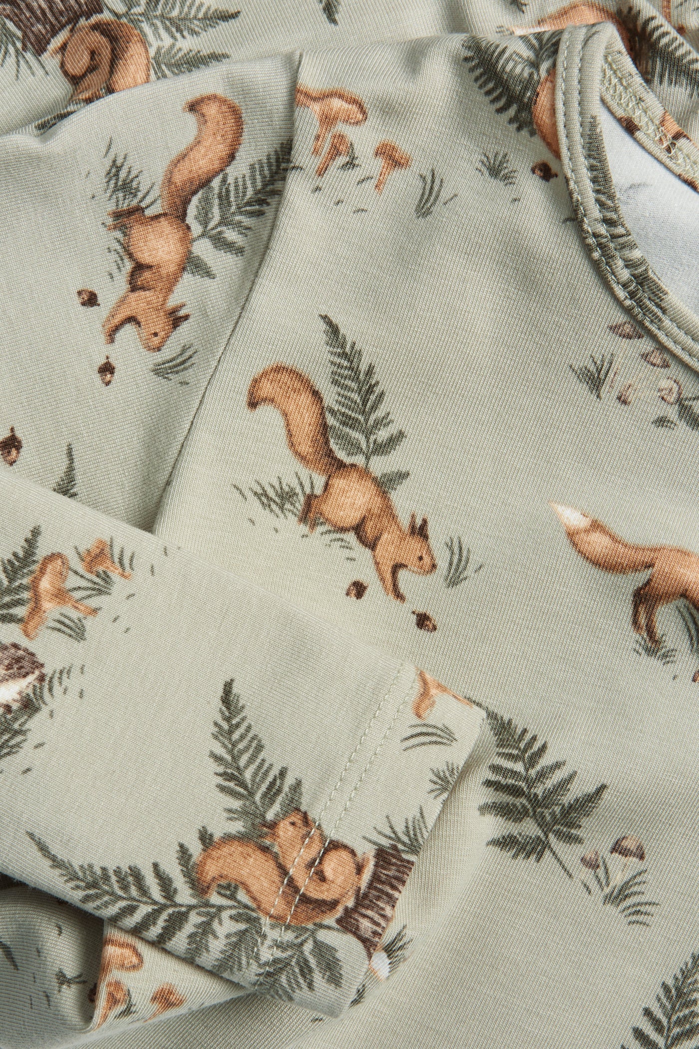 Baby green bodysuit with animals