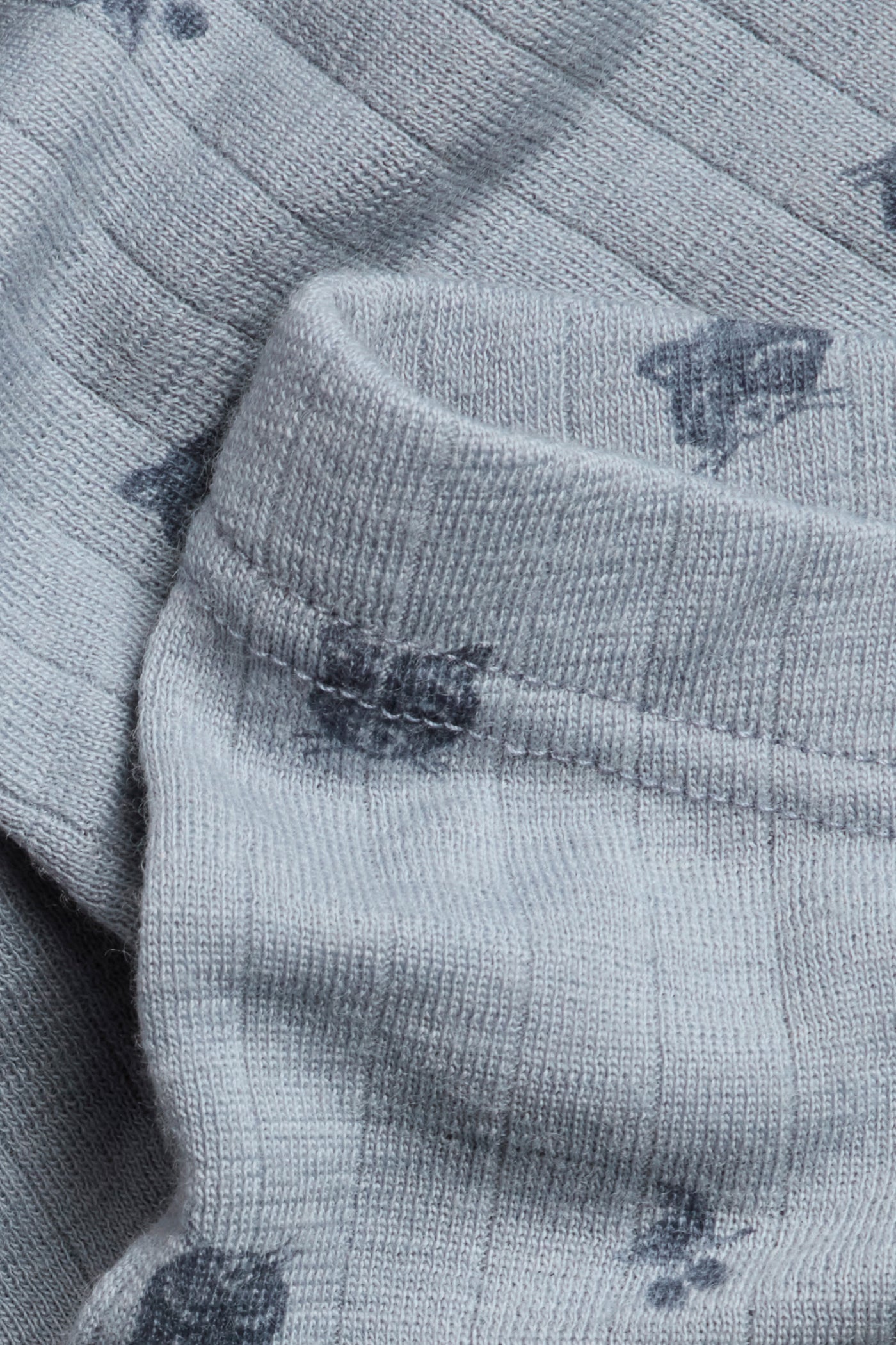 Kids´ blue merino wool leggings with raccoons