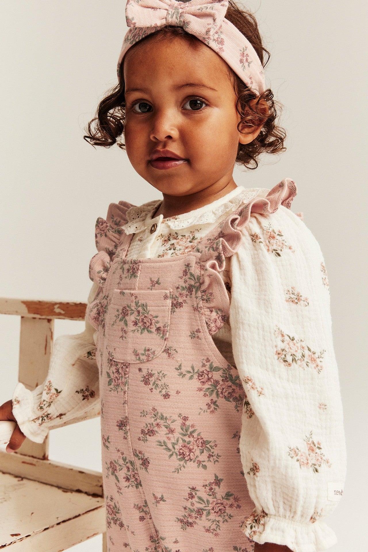 Baby pink floral frill dungarees