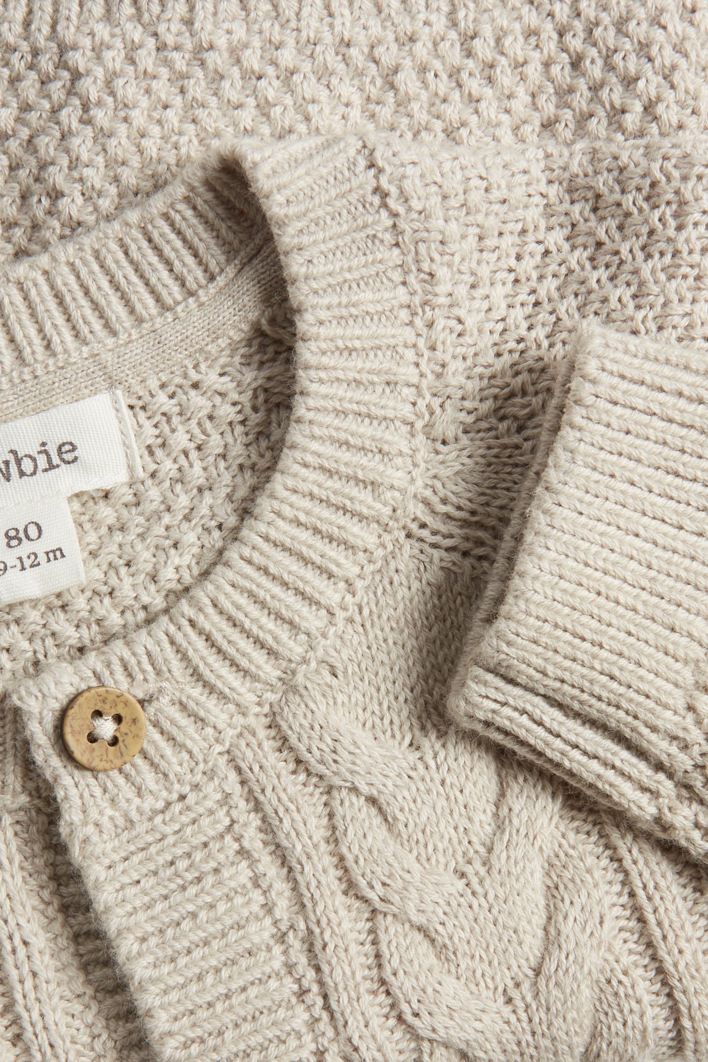 Baby beige knitted cardigan