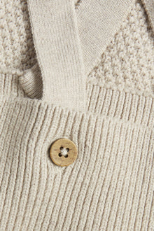 Baby beige knitted dungarees