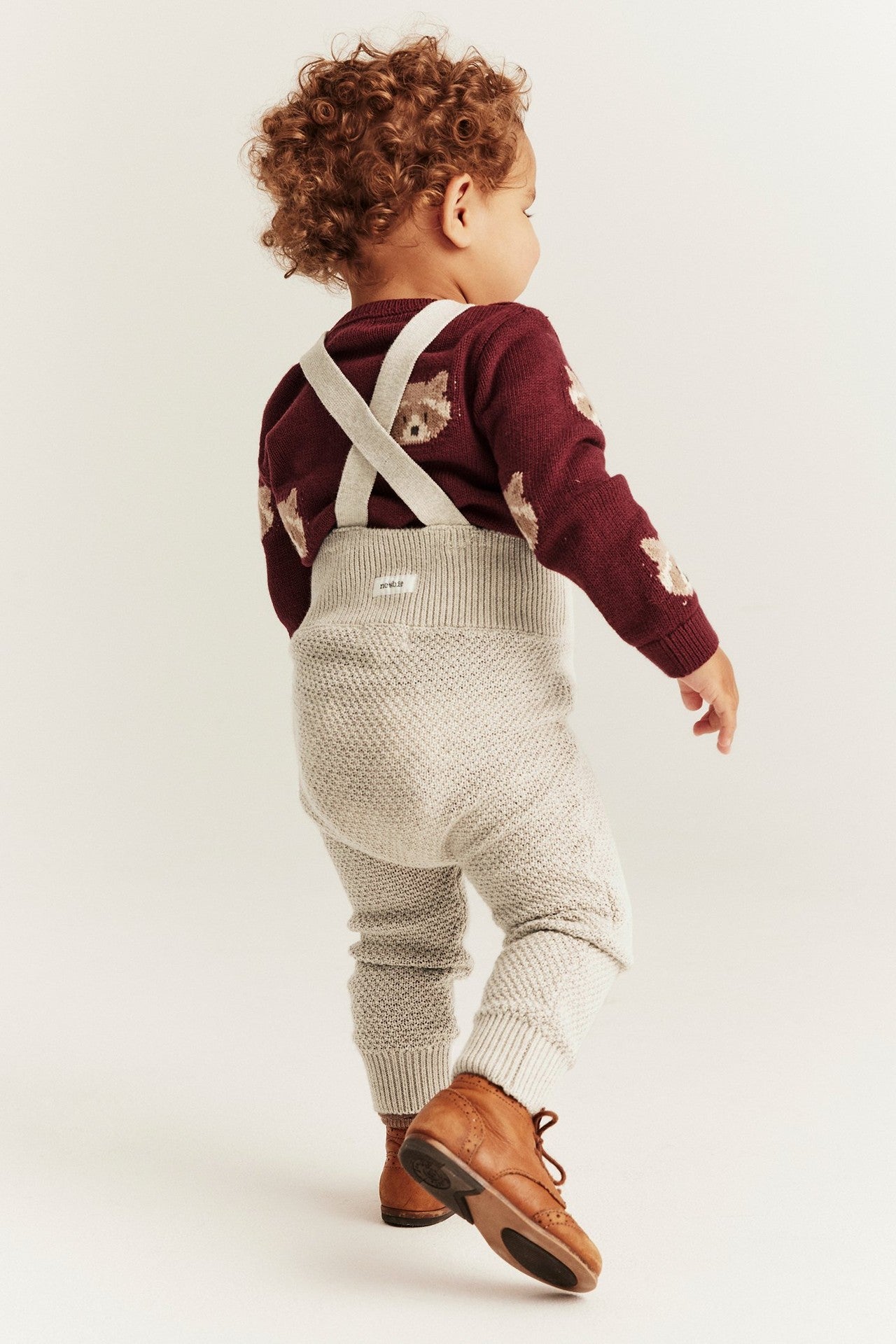 Baby beige knitted dungarees