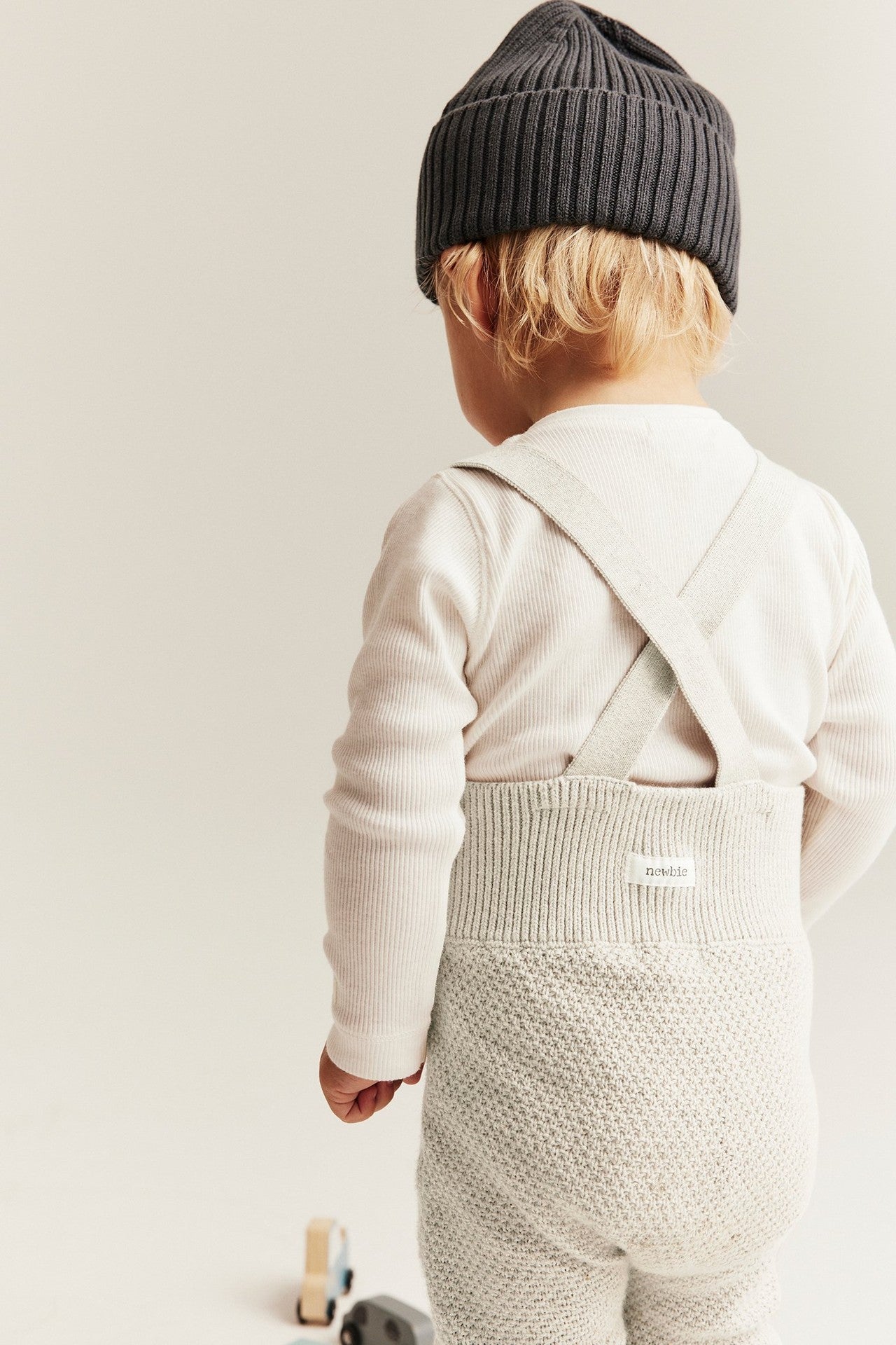 Baby beige knitted dungarees