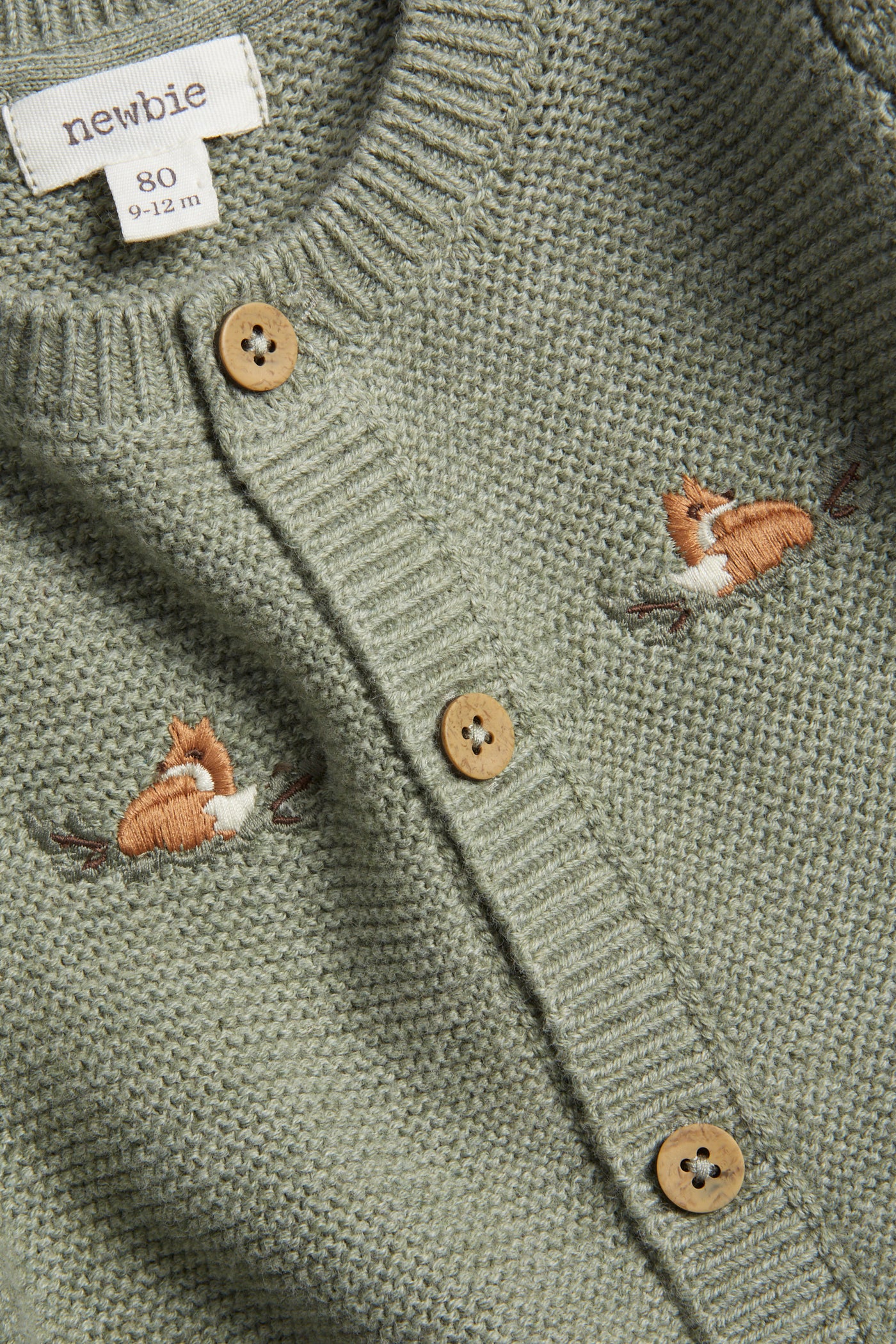 Baby green cardigan with embroidered foxes
