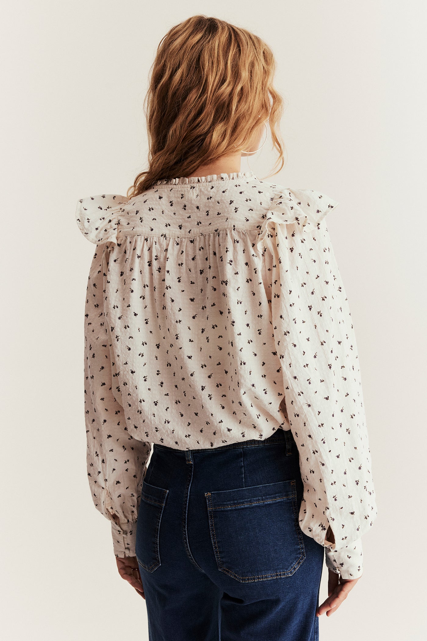 Women's beige floral blouse with frill