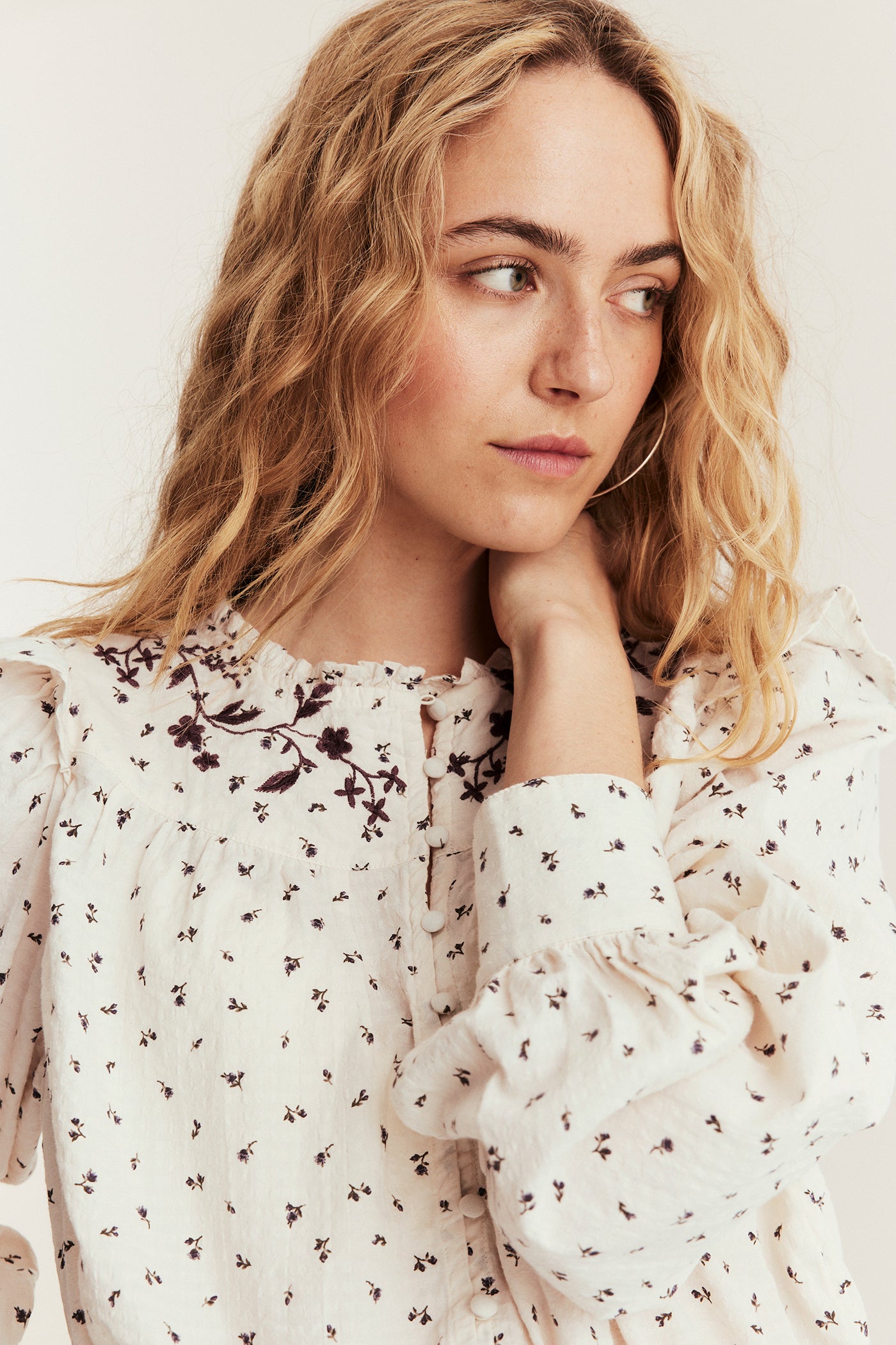 Women's beige floral blouse with frill