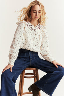 Women's beige floral blouse with frill