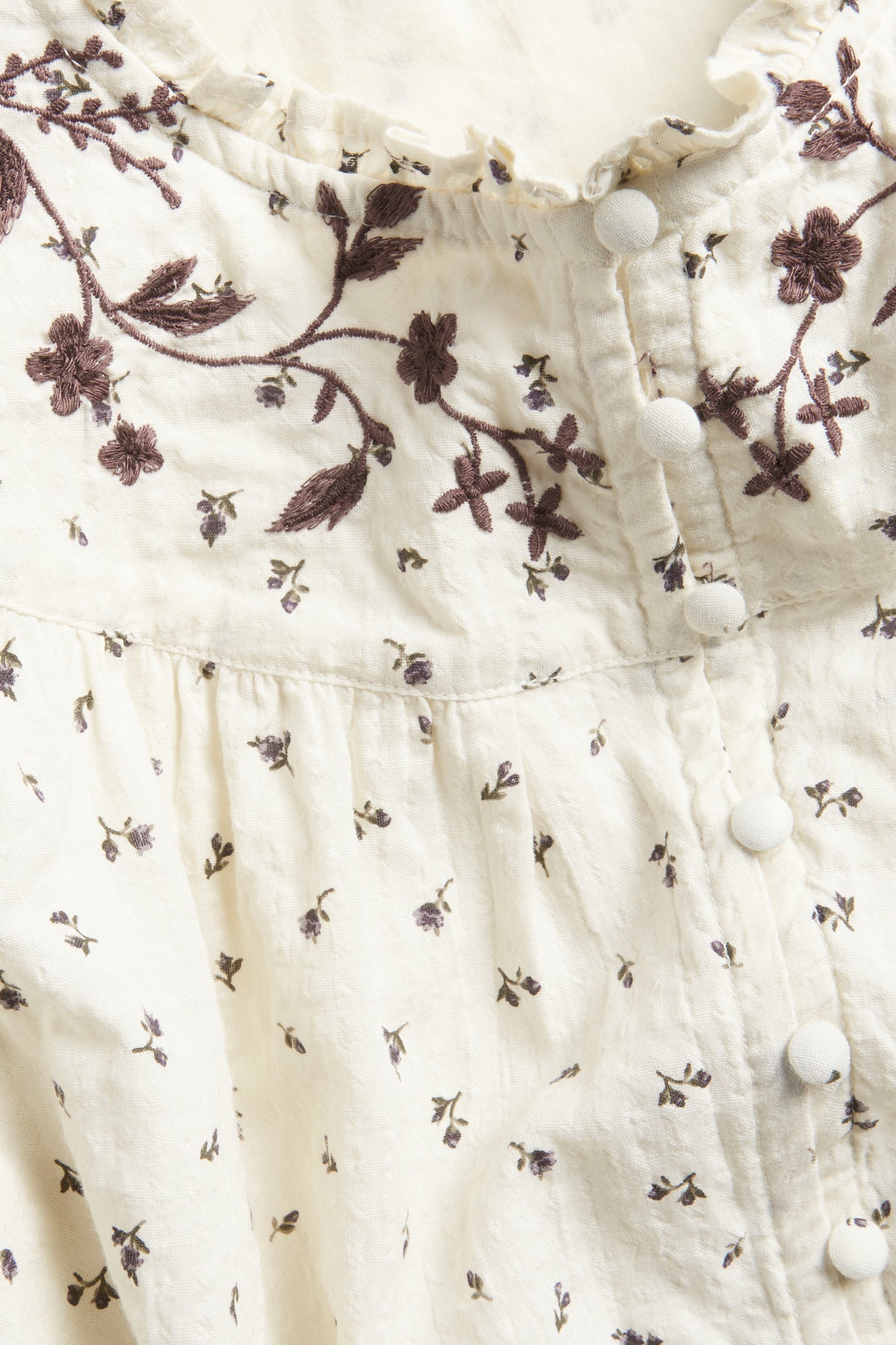 Women's beige floral blouse with frill
