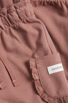 Baby pink joggers with laced pockets