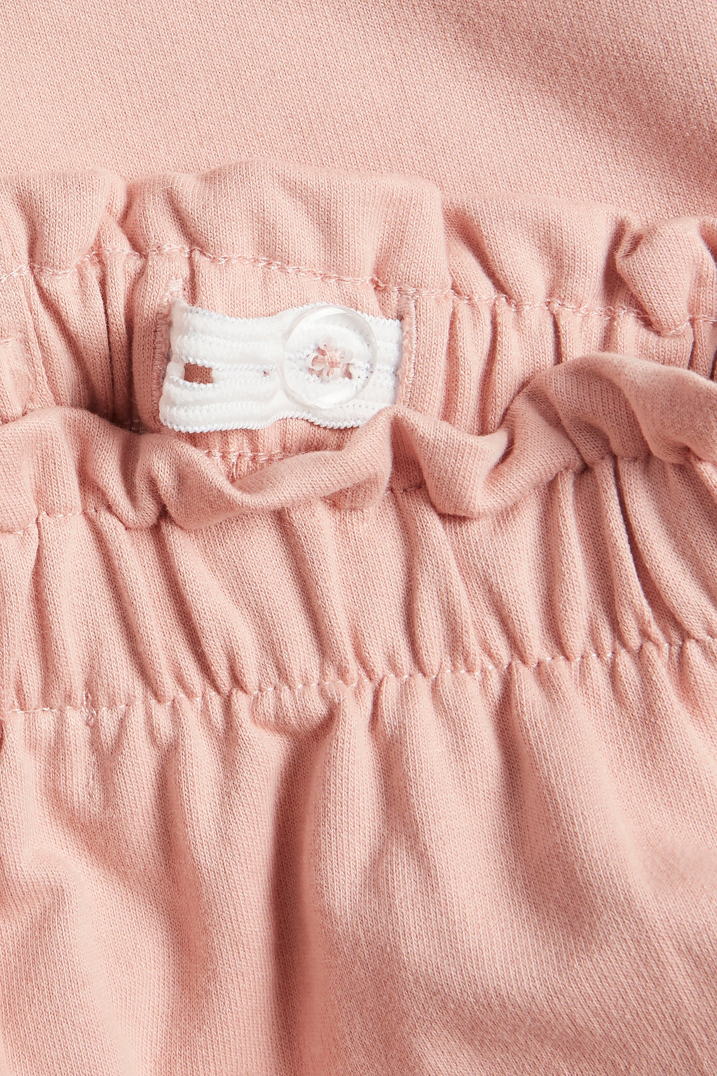 Kids' light pink jogger trousers