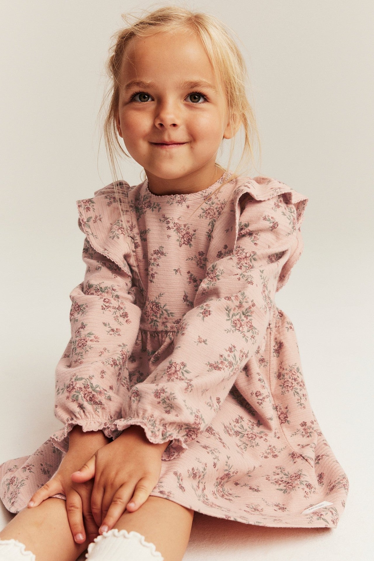 Kids' pink floral dress with frills