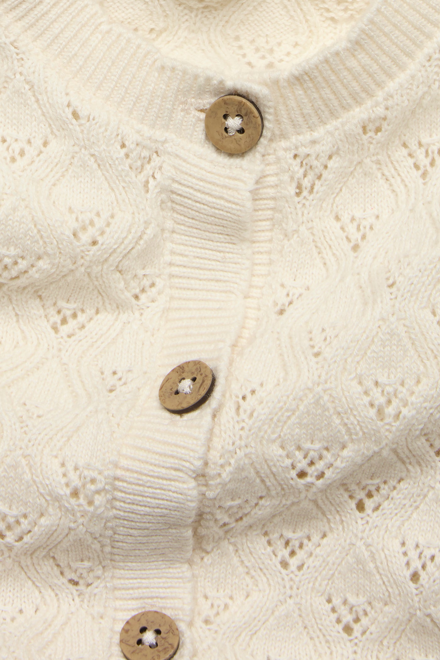 Baby beige knitted romper