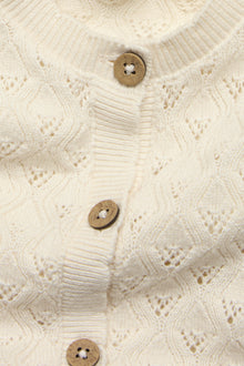 Baby beige knitted romper