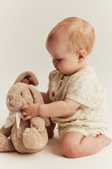 Baby beige knitted romper