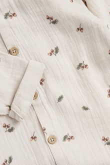Baby beige onesie with acorns