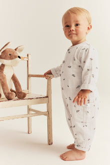 Baby beige onesie with acorns