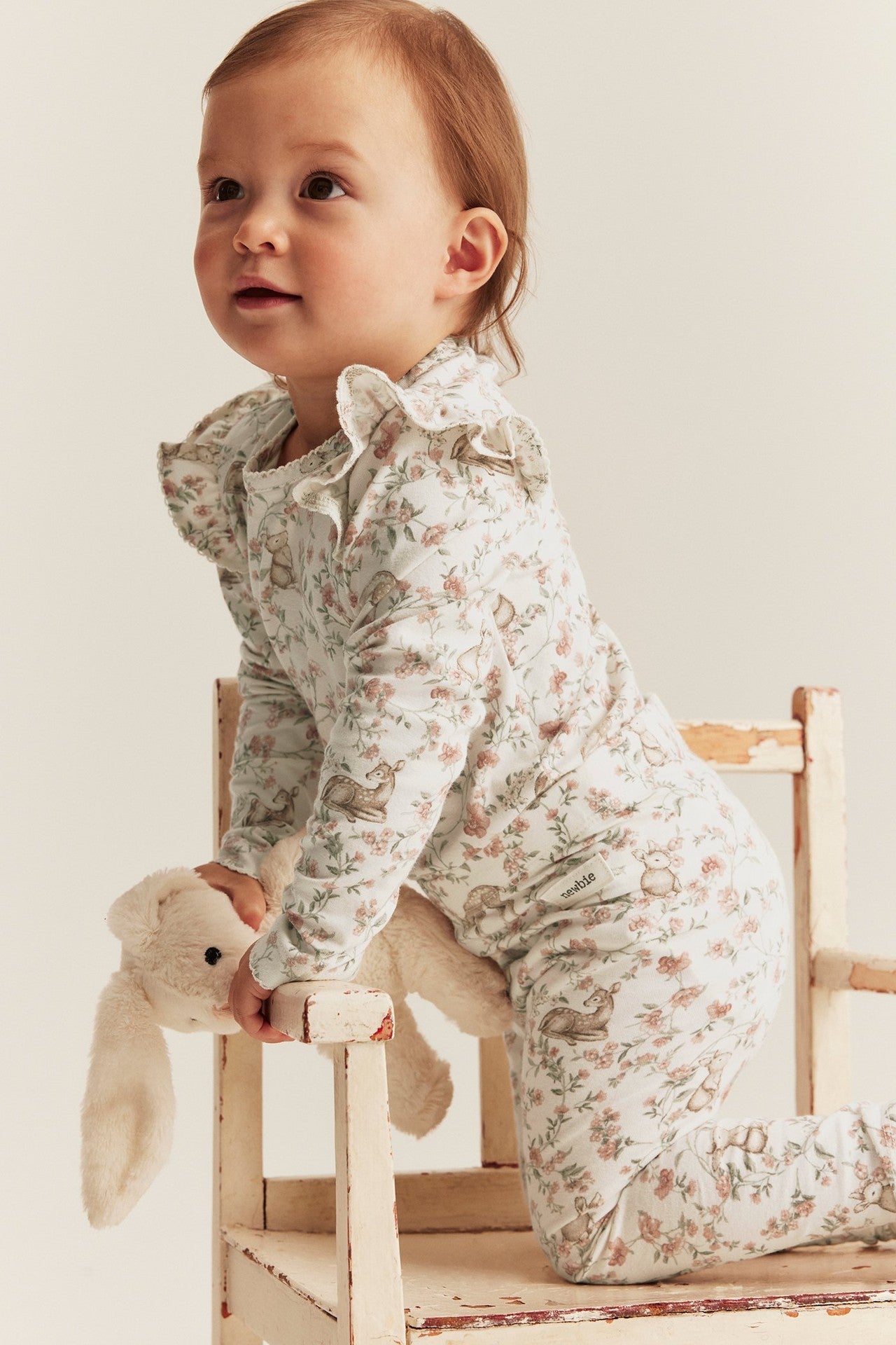 Baby white floral bodysuit with animals