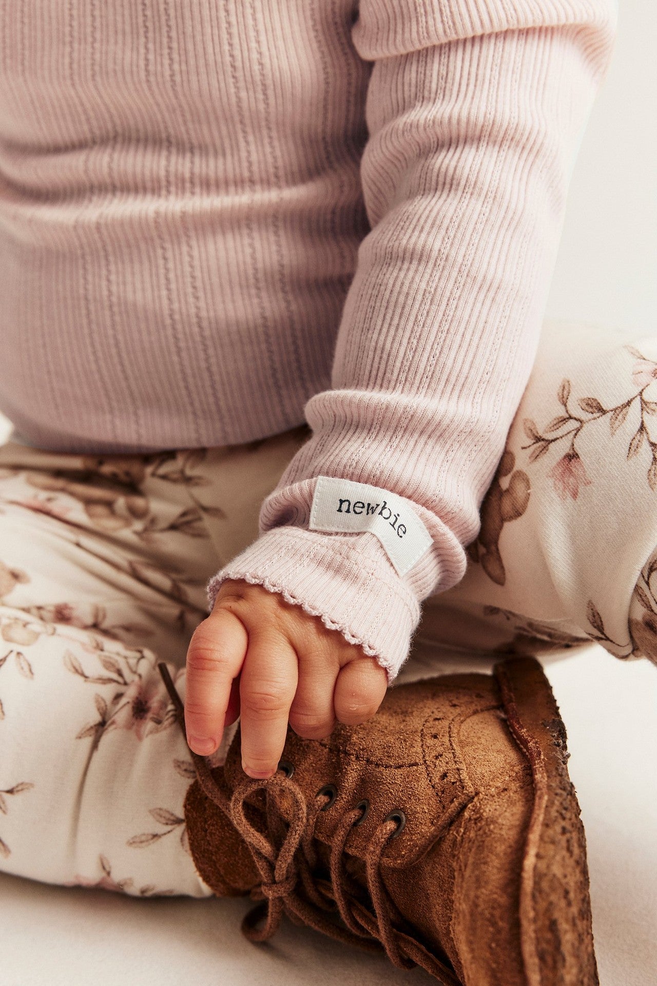 Baby pink bodysuit with ruffles