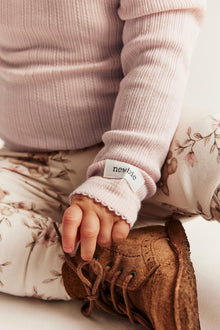 Baby pink bodysuit with ruffles