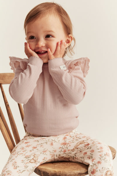 Baby pink bodysuit with ruffles