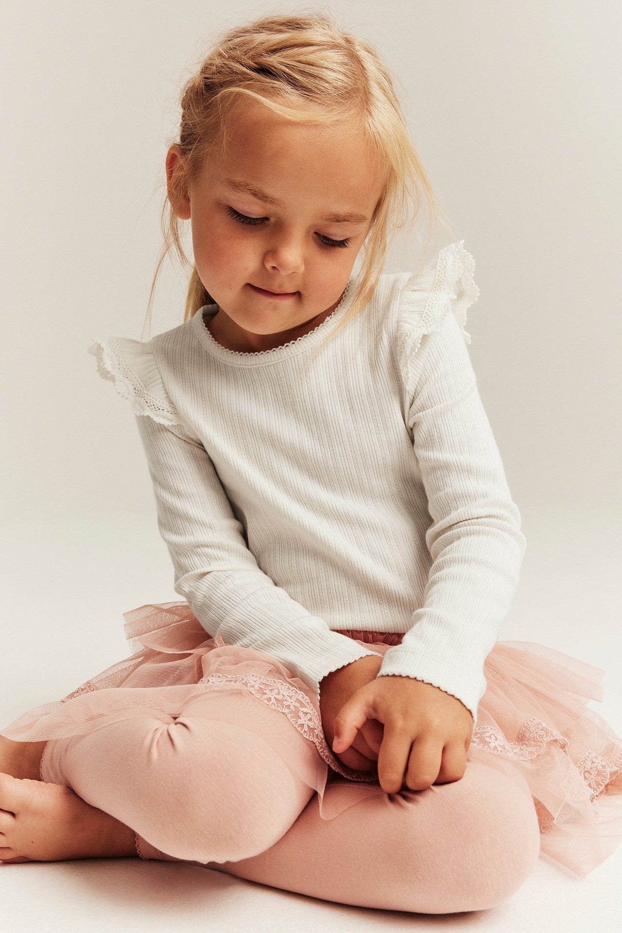 Kids white ribbed top with frills
