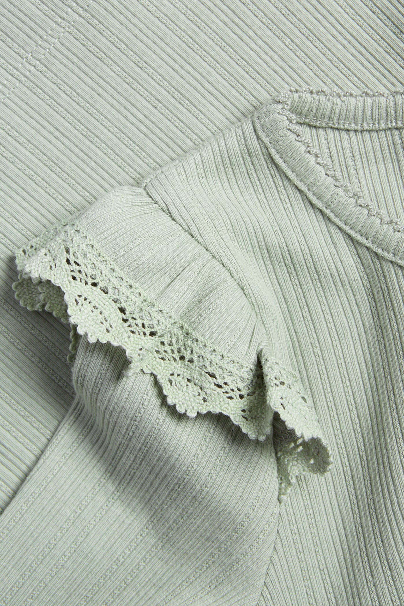 Kids' green ribbed top with frills
