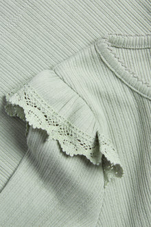 Kids' green ribbed top with frills