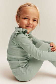 Kids' green ribbed top with frills