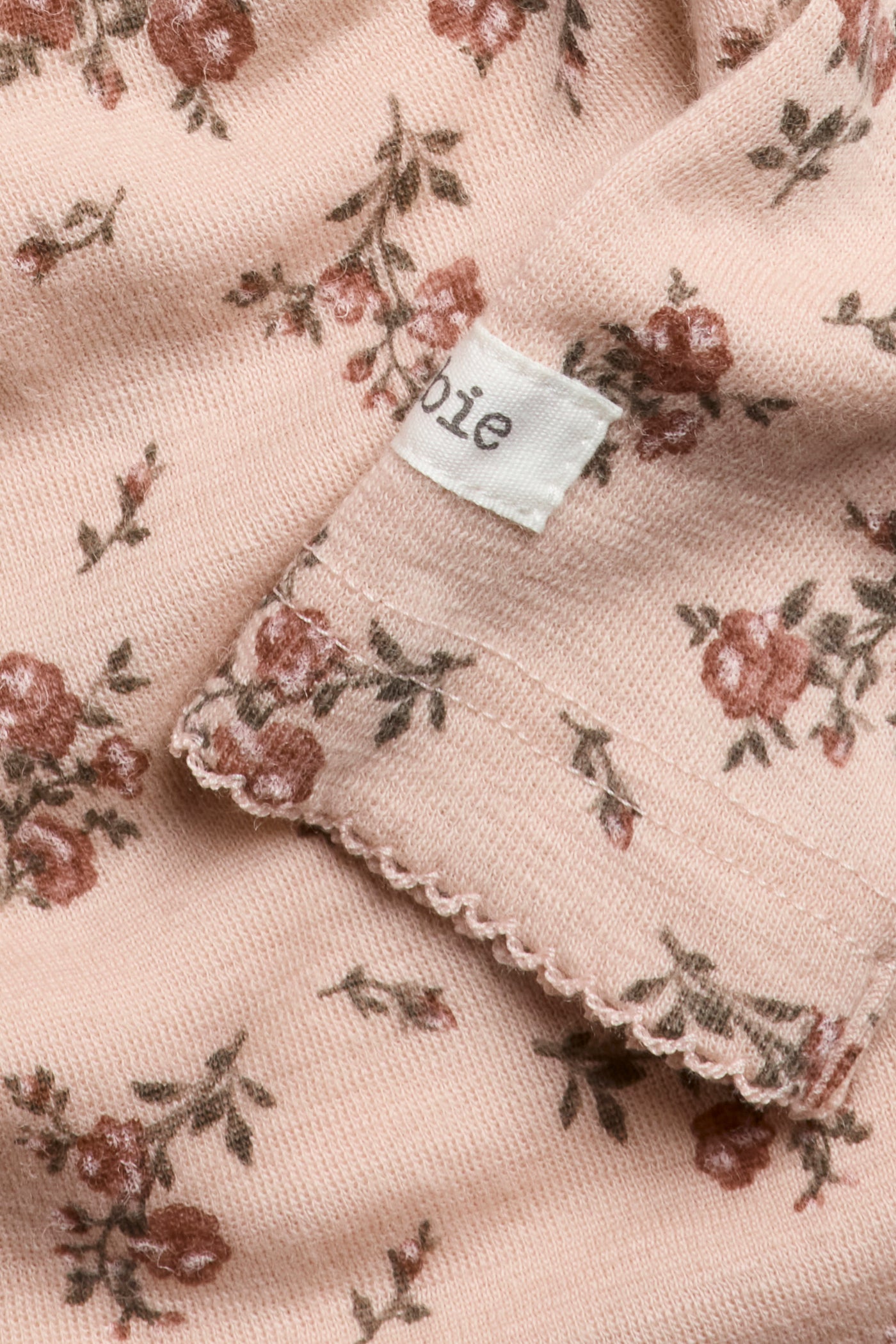 Baby pink floral merino wool bodysuit